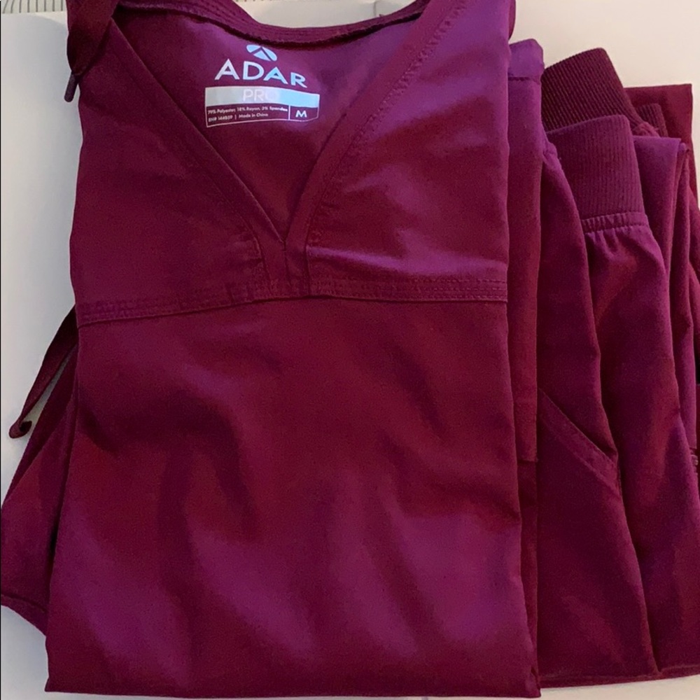 Burgundy scrub top and two bottoms hardly used